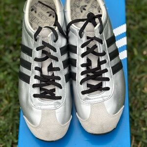 Adidas Women's Silver and Black Athletic Shoes.